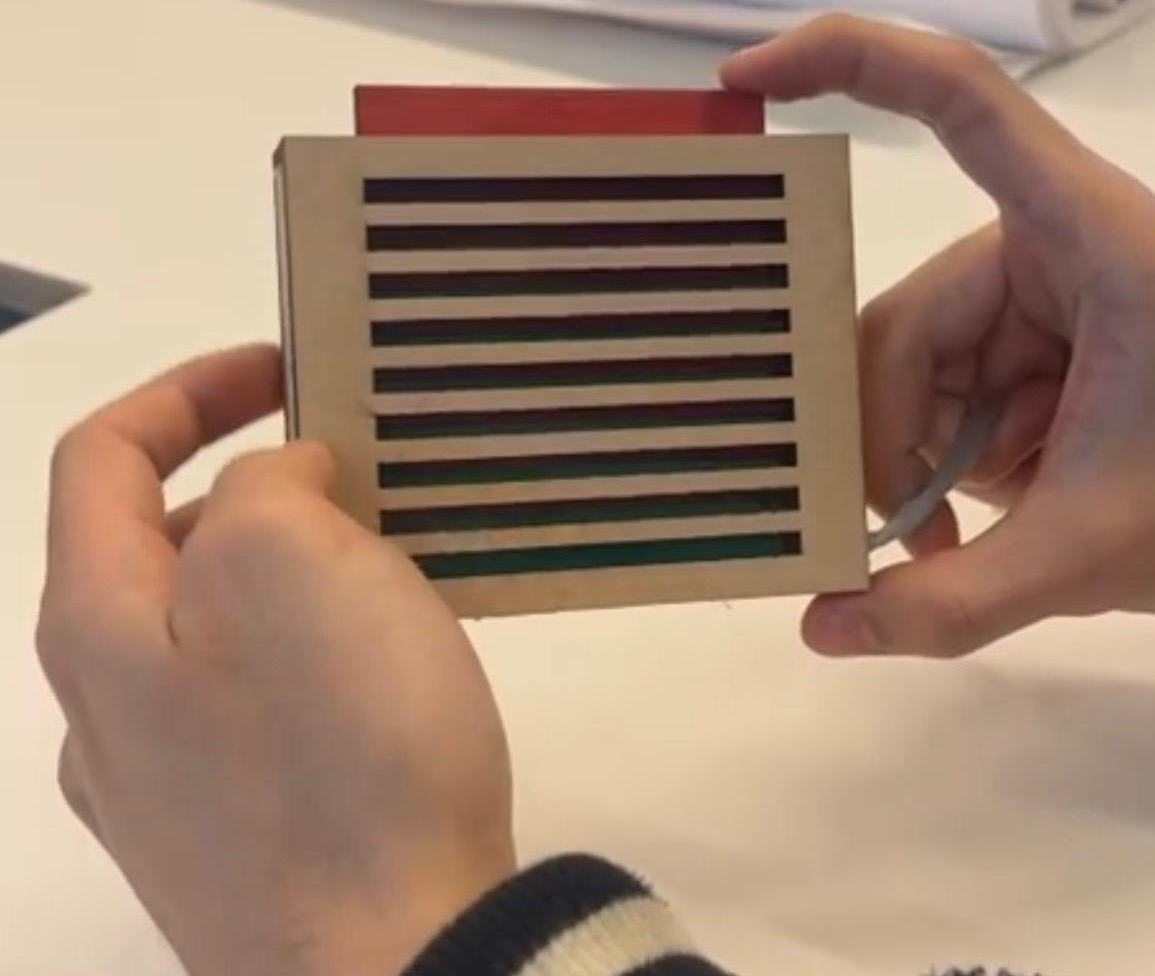 The side reminder physical prototype held in hand